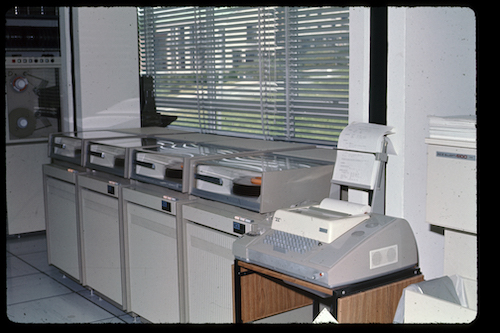 Disc drives, a tape drive and a teletype in the Computer Room