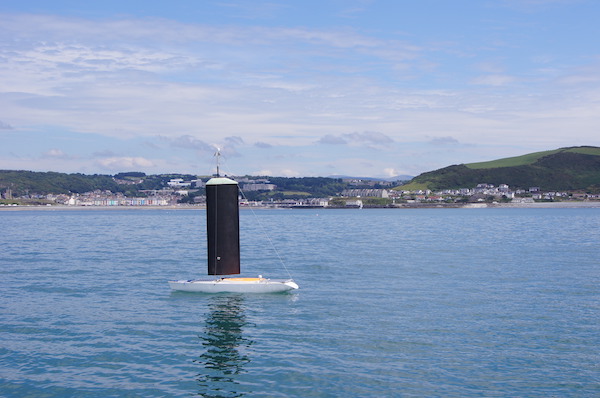 Beagle-B sailing past Old College at sunrise after test sailing overnight during the 2007 Microtransat Challenge competition in Aberystwyth, September 2007