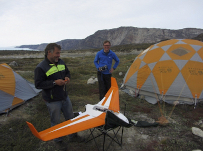 Glaciologists, preparing a fixed wing UAV in Greenland, 2013